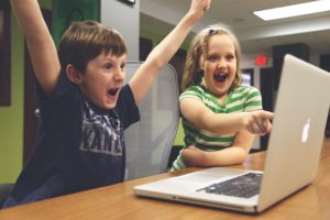 kids in front of a laptop