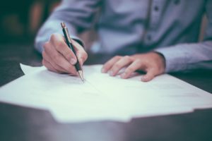 a man holding a pen