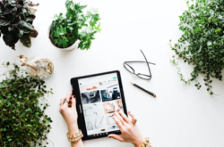 person using black tablet computer photo